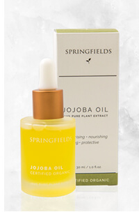 ホホバオイルの箱とボトルの写真